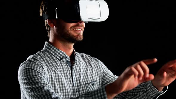 Smiling man using virtual reality headset 4k