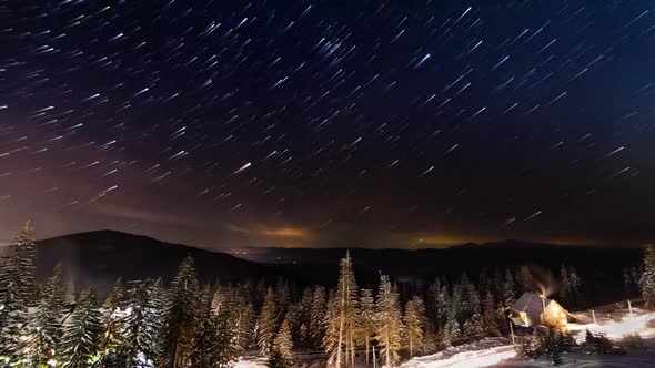 Stars Moving Above Small House In The Mountains In WInter. Ukraine, Carpathian