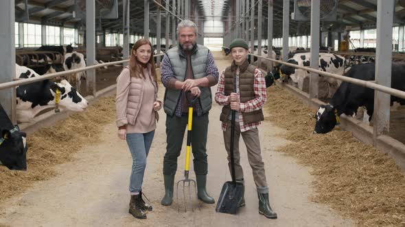 Family Posing inside Dairy Farm