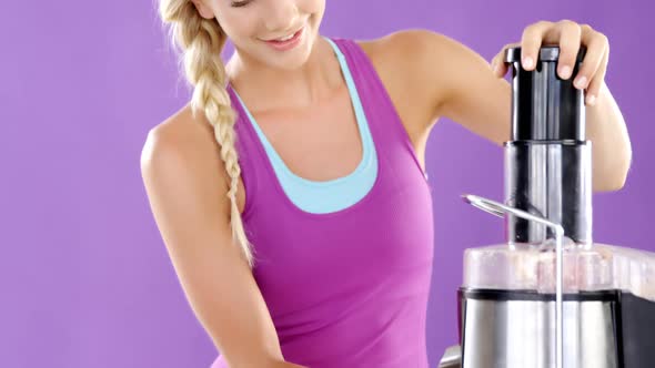 Beautiful woman preparing smoothie