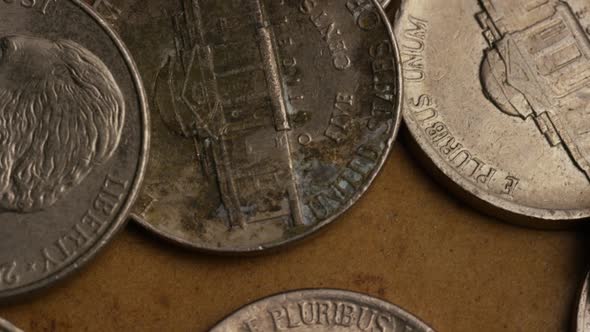 Rotating stock footage shot of American nickles (coin - $0.05) - MONEY 0201