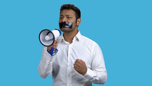 Man with Taped Mouth Unable to Speak Out