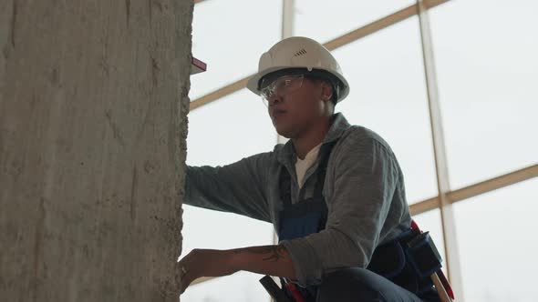 Construction Worker Using Bubble Level