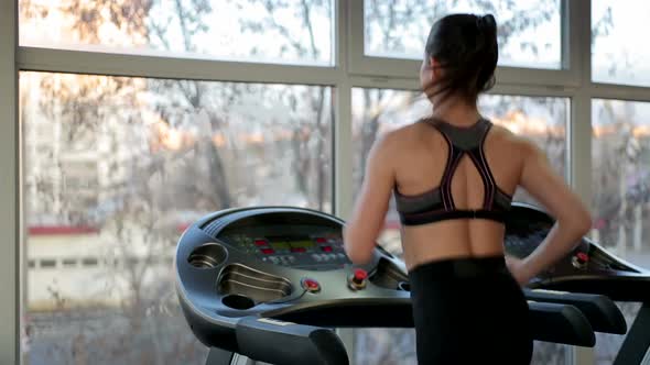 Successful Young Lady Training on Treadmill in Gym, Working Hard to Achieve Goal