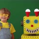 Happy child with toy robot in class. Slow motion - VideoHive Item for Sale