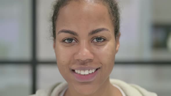 Face of African Woman Smiling at the Camera