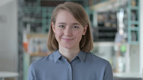 Portrait of Young Woman Shaking Head As Yes Sign