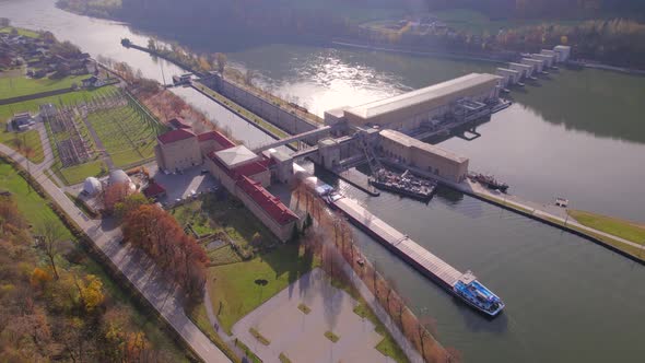 Cargo Pusher Transport Boat Traversing a Lock Moving Freight and Goods