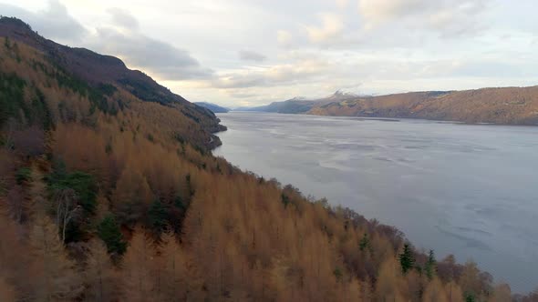 Aerial View of Loch Ness and Surrounding Forests in Scotland