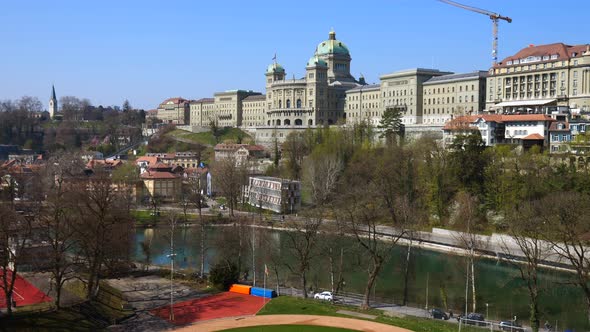 Wide shot of beautiful Federal Palace Building in Bern during sunny day and blue sky in backdrop - B