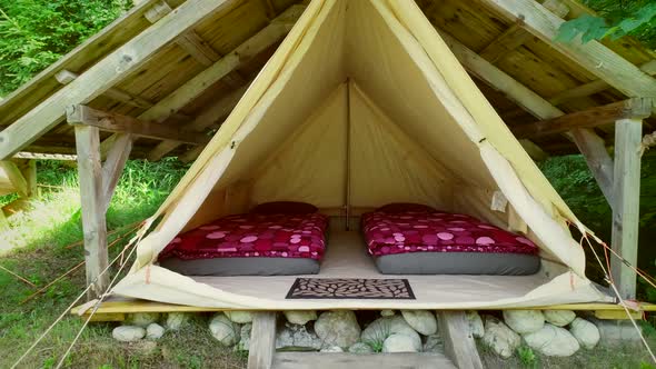 Tracking shot of tent in an eco camping in Slovenia.