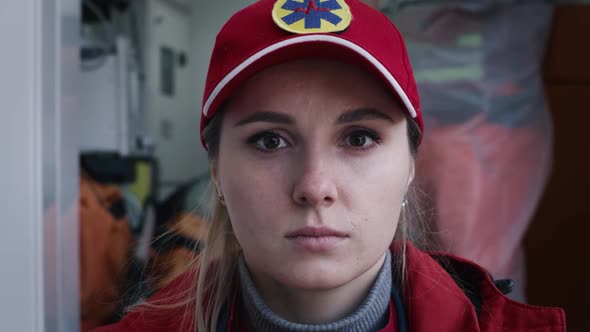 Young Doctor Standing Near Ambulance