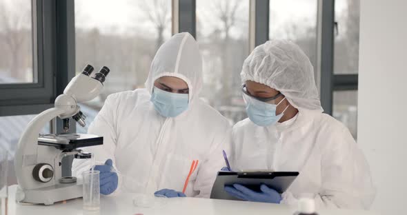 Researchers During Andemic Checking Sample in Biochemistry Lab