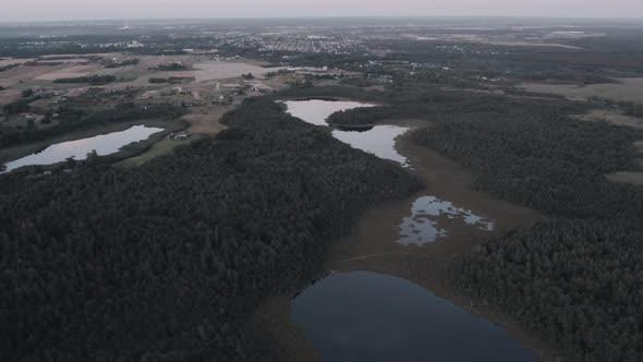 Aerial photography of the lake swamp from a drone at sunset with beautiful sun flares. reflection of