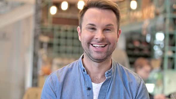 Portrait of Happy Casual Man Smiling at Camera