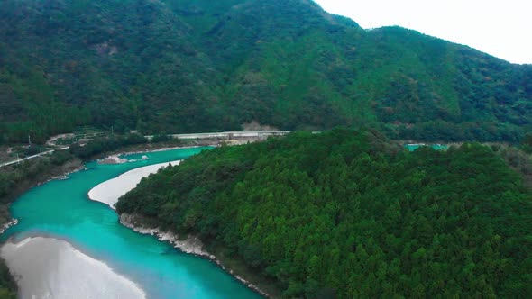 small village in japan alongside a beautiful river