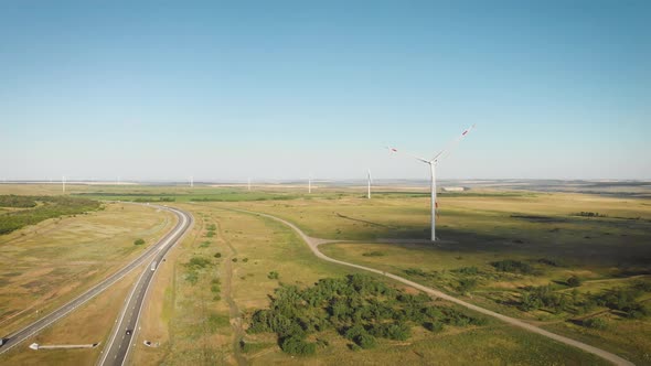 Aerial View of Wind Turbine on a Field in a Summer Day