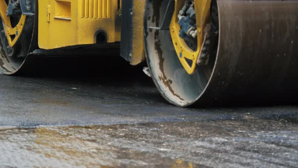 Two Steamrollers Leveling Highway Surface