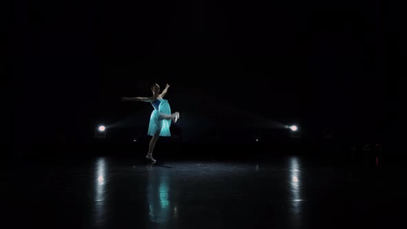 Young Ballerina Dancing on Stage