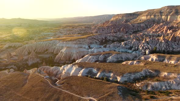 }Hoodoos, Fairy Chimneys an Sedimentary Volcanic Rock Formations in Sunset