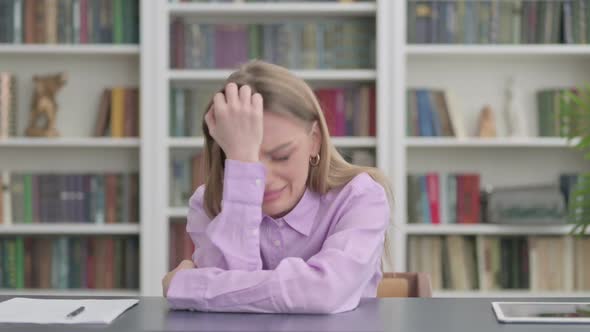 Upset Woman Feeling Worried While Sitting in Office