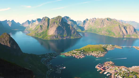 Pan Right of Reine Fishing Village with Mountains and Fjords on Lofoten Islands