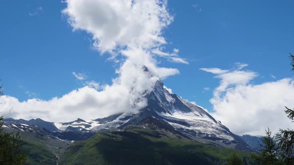 Timelapse of clouds moving around the Matterhorn at midday - Zermatt, Switzerland