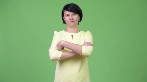 Beautiful Businesswoman Smiling with Arms Crossed