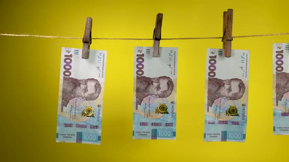 Ukrainian Currency is Dried on a Rope