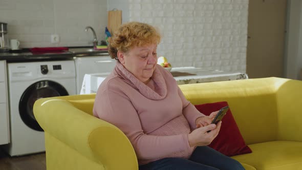 Mature Woman Using Smartphone Texting Browsing Social Media Reading Text Messages