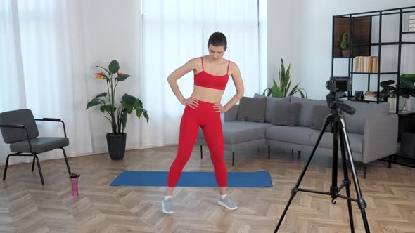 Sport Muscular Woman Tells Trains Teaches Student Record Online Course on Camera