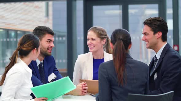 Businesspeople discussing during meeting in office