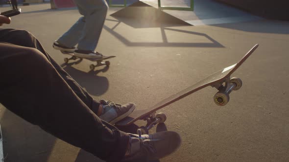 Unrecognizable Teenagers in Skatepark