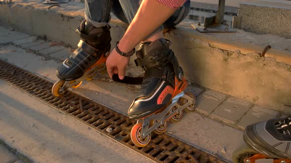 Feet on Rollerblades.