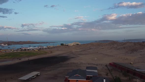 Beautiful sunrise over the Luderitz city with amazing port, colorful sky