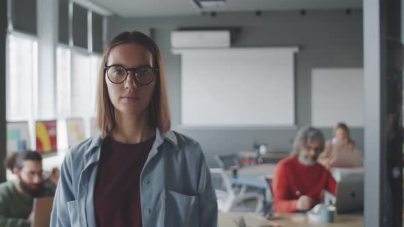 Portrait of Young Confident Businesswoman in Office