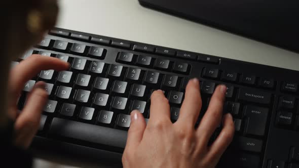 Busines woman typing on keyboard