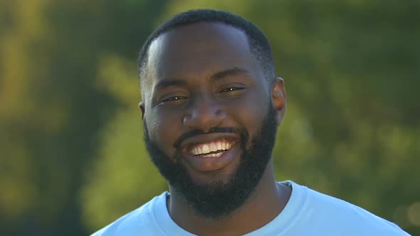 Friendly Afro-American Male Looking to Camera and Smiling, Successful Business