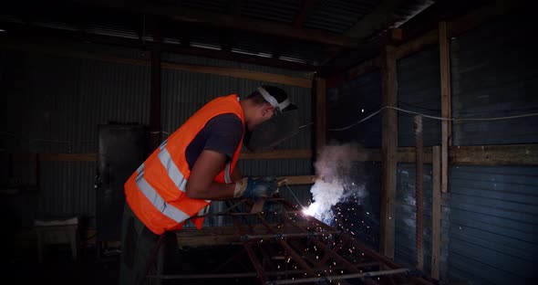 Slow Motion. Welder Welding The Worker Performs Metal Welding at the Factory or Construction Site