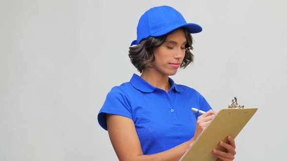 Happy Delivery Girl with Clipboard and Pen Writing