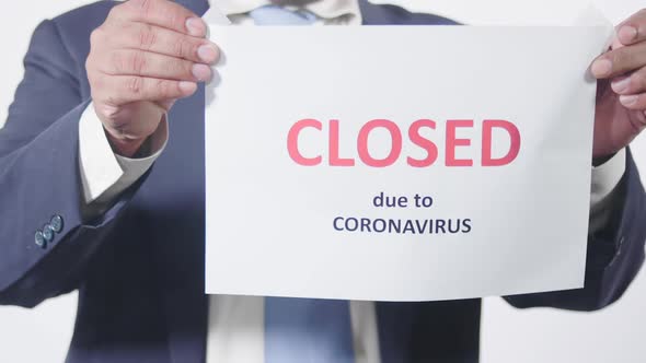 Asian Businessman Writes Closed Due To Coronavirus