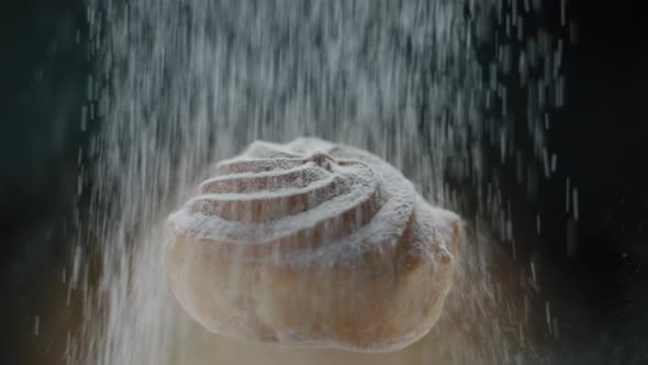 Profiterole with Custard Cream with Pouring Powdered Sugar