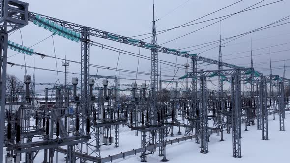 Aerial view of a high voltage electrical substation in winter season.