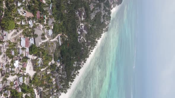 Vertical Video of the Ocean Near the Coast of Zanzibar Tanzania Aerial View