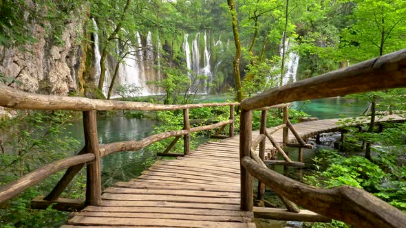 Boardwalk in Plitvice Lakes National Park, Croatia. Transparent Turquoise Colored Waters of the Lake