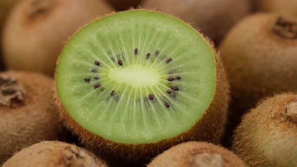 kiwi fruit. heap sliced and whole kiwi fruit close up