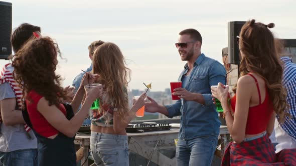 Cocktail Toast at Rooftop Day Party