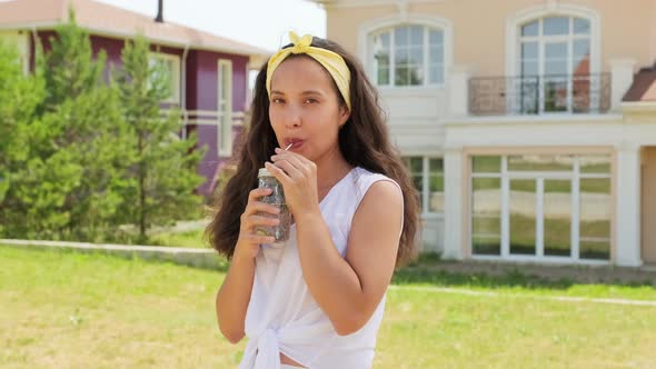 Portrait Of Beautiful Woman Drinking Lemonade