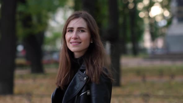 Beautiful woman walking in the autumn park