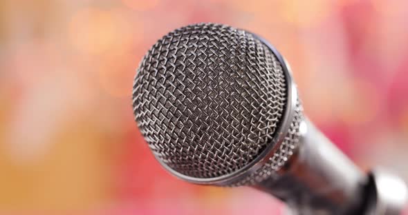 Microphone on Stage Against a Blurry Light ,Blurry Background